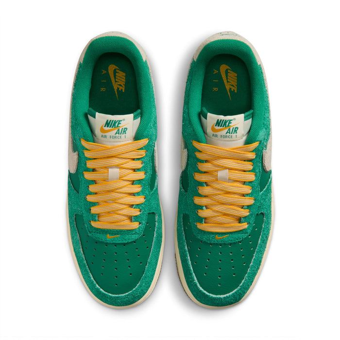 Women’s Air Force 1 low-top sneakers, green uppers, orange-yellow laces, tan inner
