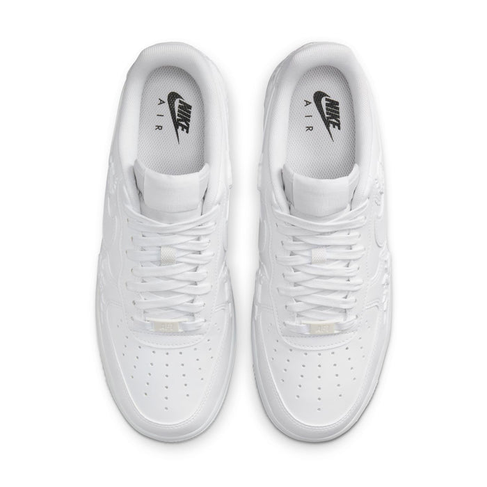 Women's Nike white sneakers, top view showing laces and logo on insoles