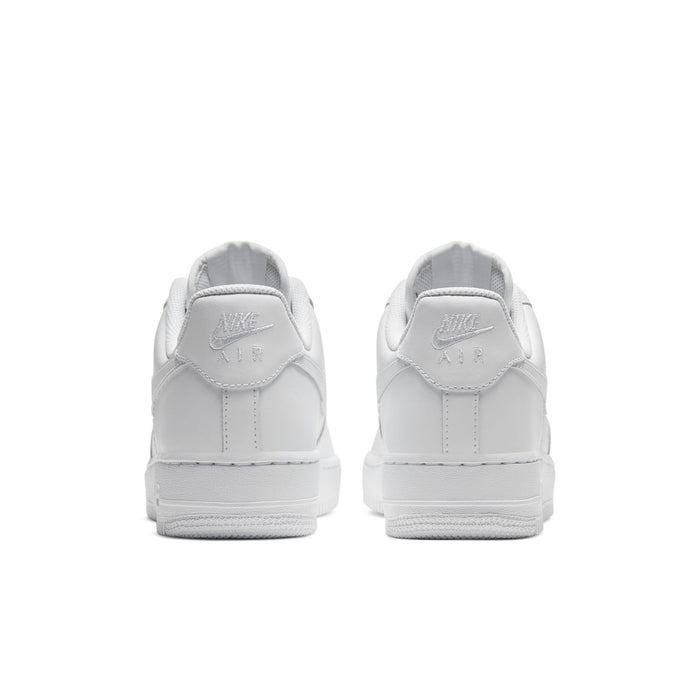 Women's white sneakers, rear view with Nike Air logo on heel tab