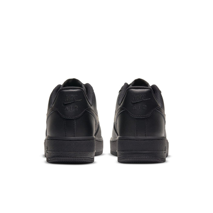 Black women’s sneakers heel view, cushioned collar and stitched logo detail
