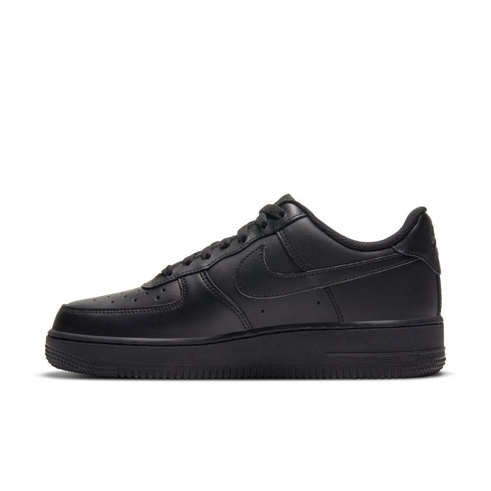 Black women’s low-top sneakers, front side view with perforated toe and swoosh