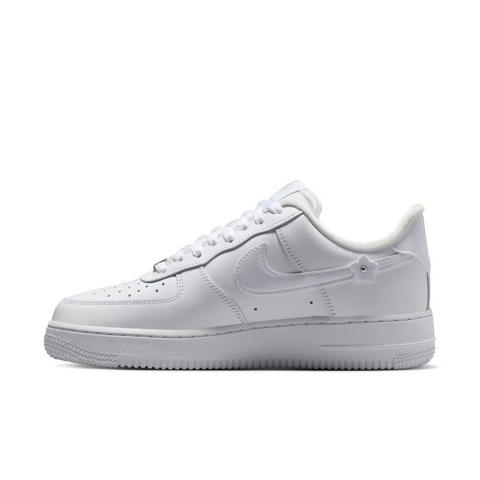 White Nike Air Force 1 low-top sneaker with lace-up, swoosh, and perforated toe