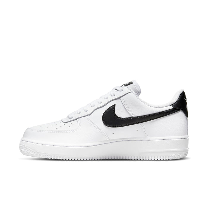 Women’s white low-top sneaker with black Swoosh overlay and lace-up front