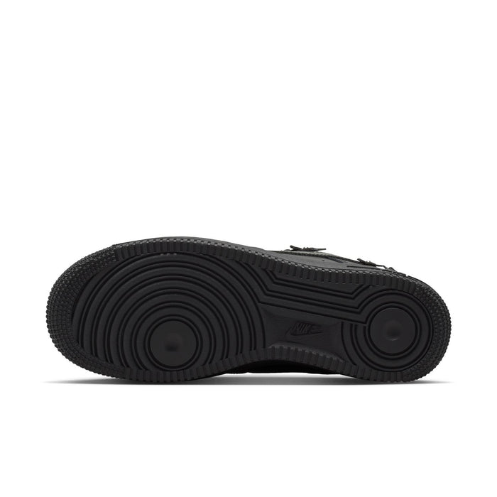 Women's black low-top sneaker outsole view with durable tread and Nike logo