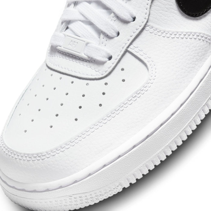 White sneaker toe and lace panel detail with perforations and textured leather