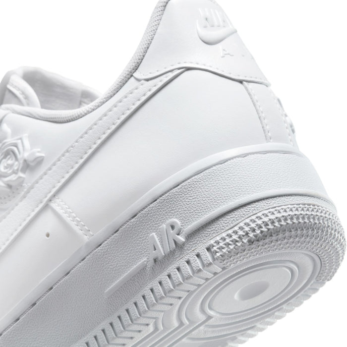 Women's Nike white sneaker close-up of heel and outsole with 'AIR' midsole text