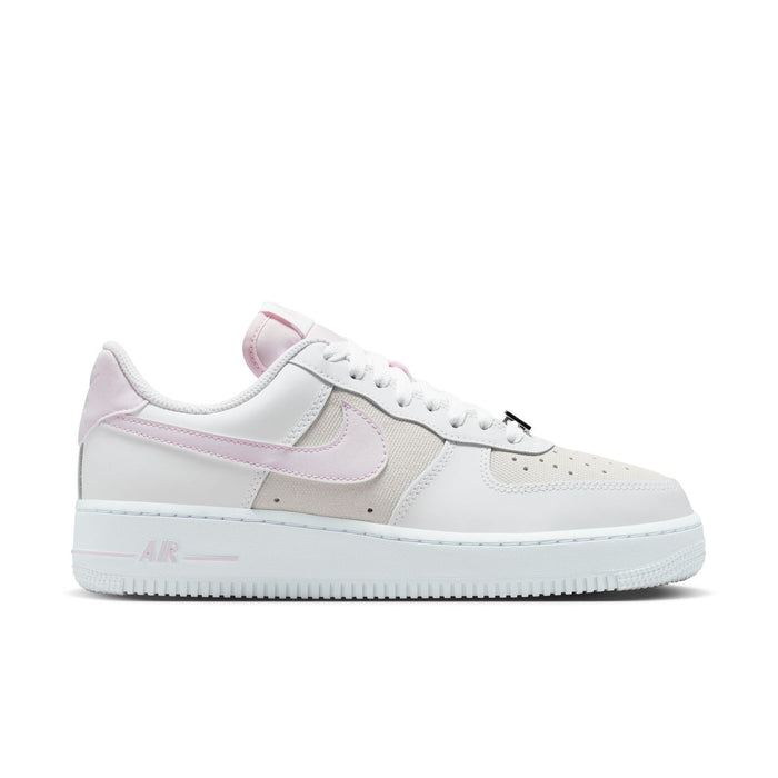 Women's Air Force 1 sneakers in white with lilac accents, front quarter view