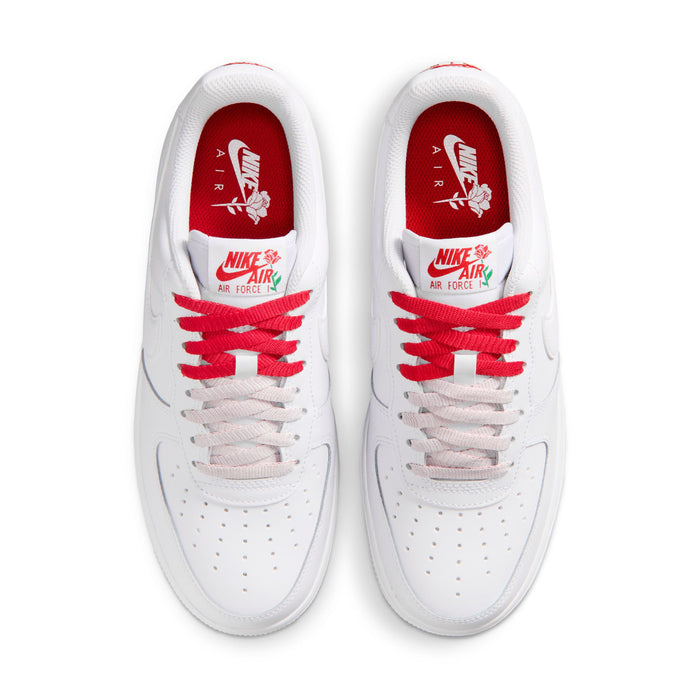 Women's white sneaker showing inner red tongue with Air Force graphic and red laces
