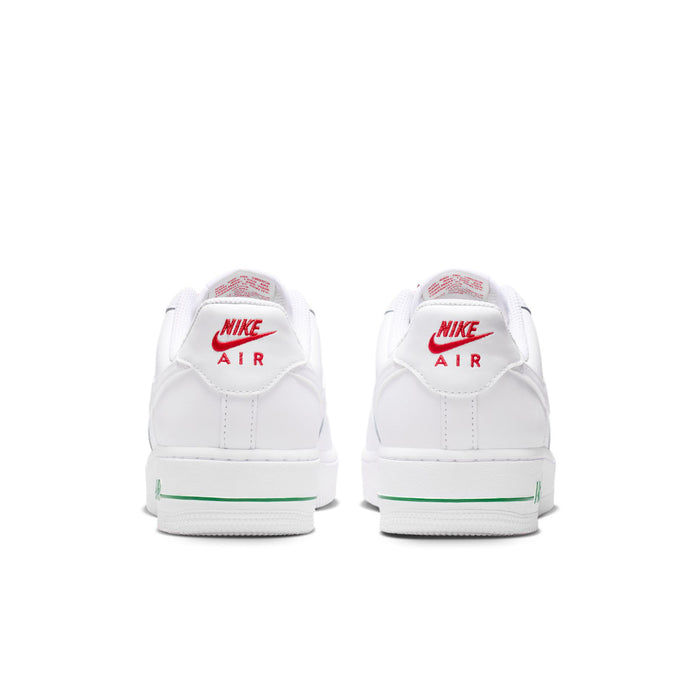 Women's white sneakers from the back with Nike Air branding and green heel stripe
