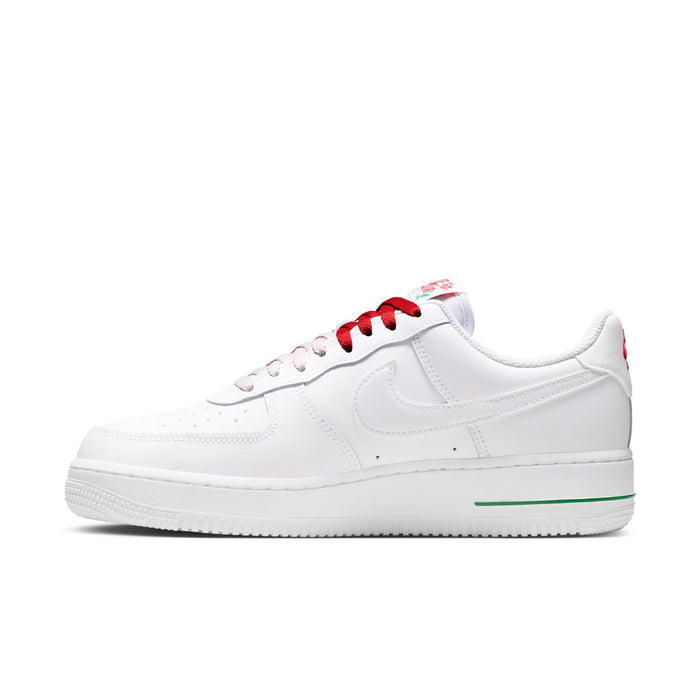 Women's white low-top sneaker with red lace-up and green line along the side