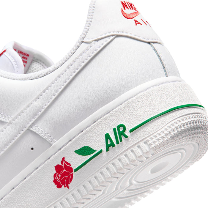 Close-up of women's white midsole with green AIR text and red rose logo