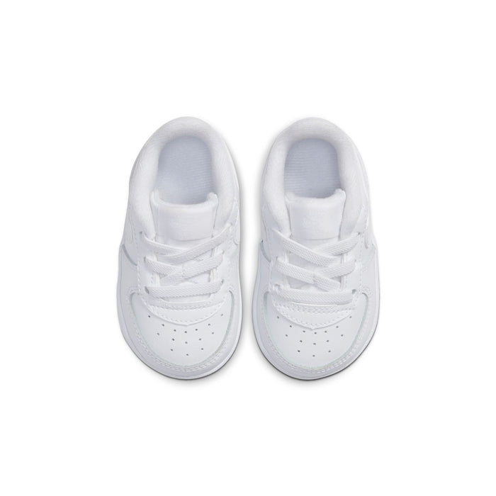 Infant white low-top sneakers, front view, padded collar and lace-up