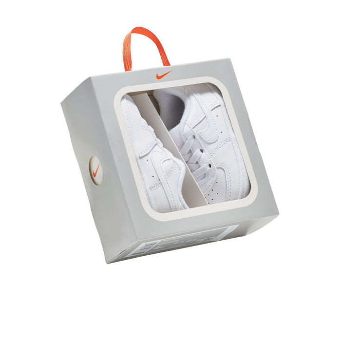 Infant white low-top sneakers in retail box, swoosh logo visible on box