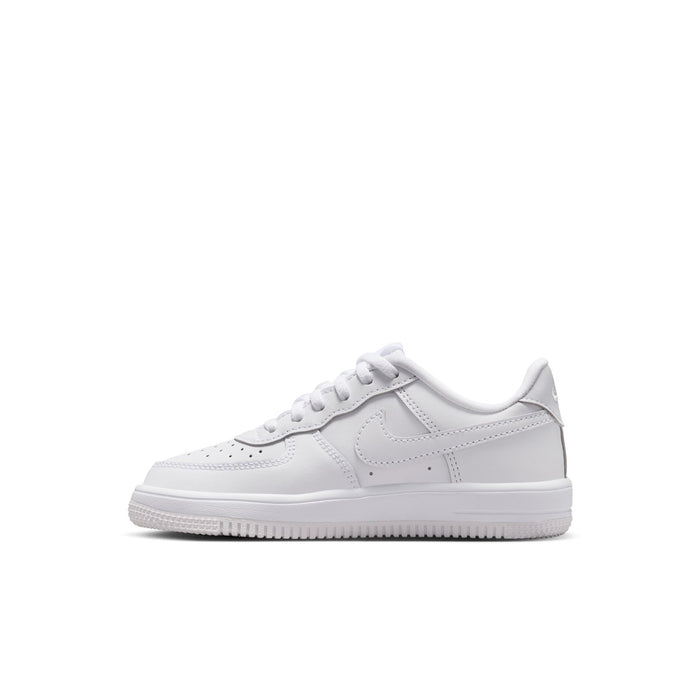 Kids' white low-top sneakers side view with lace-up and swoosh logo