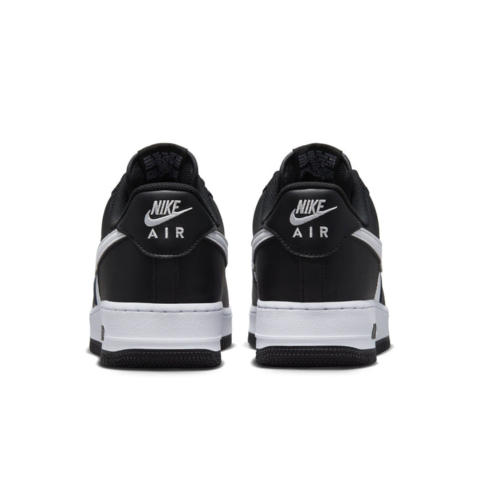 Nike Air Force 1 Low black and white leather sneakers with Nike Air heel logo, lace-up