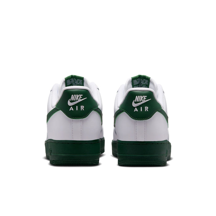 Men's white sneakers with green heel tab, Nike Air logo, and dark green outsole.