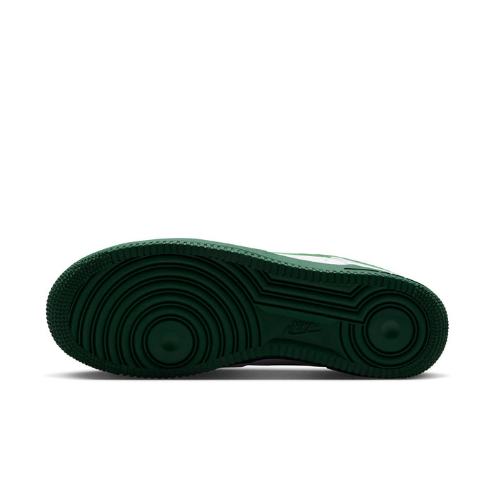 Green rubber outsole for men's white sneakers with circular tread pattern.