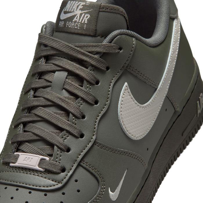 Men's Air Force 1 low-top sneaker close-up, dark olive laces and silver Swoosh