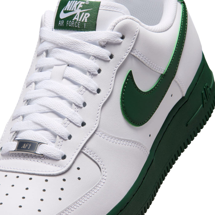 Men's white sneaker upper with green swoosh, lace-up system, and perforated toe box.
