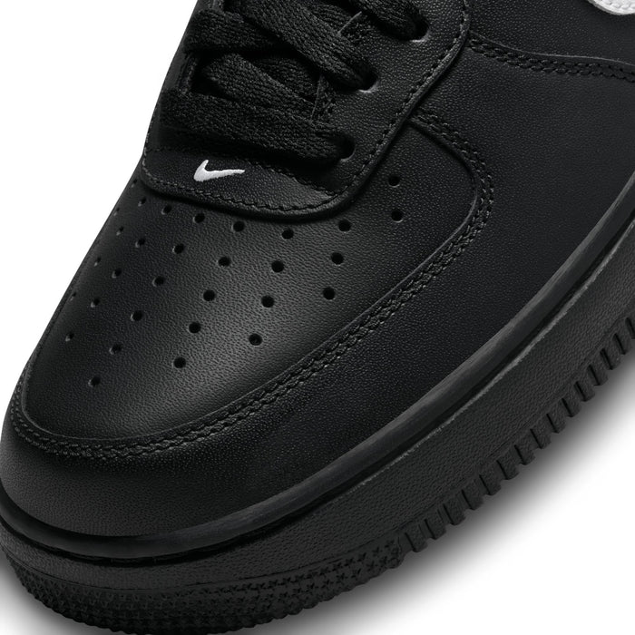 Nike Air Force 1 Low black toe box and laces close-up with perforation details