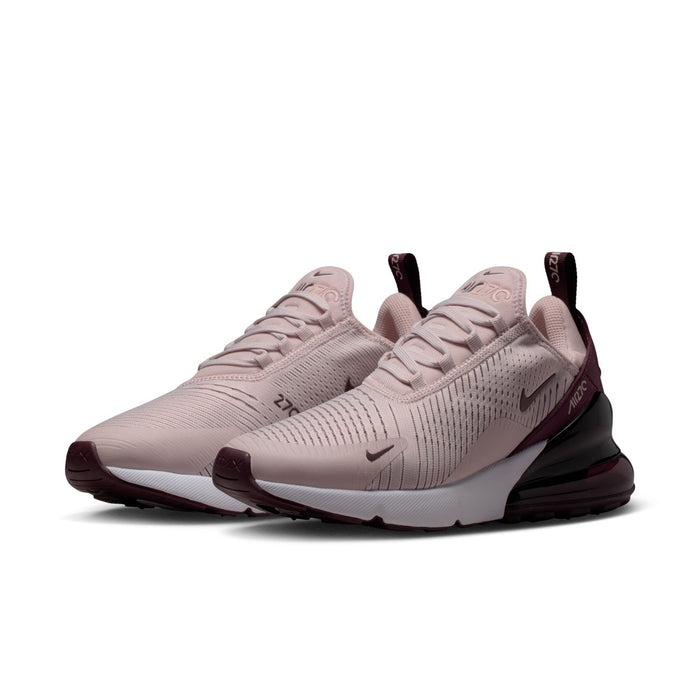 Pair of women's running shoes in dusty pink knit with burgundy collar and black air sole
