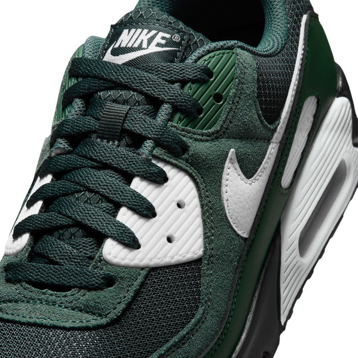 Air Max 90 upper close-up with dark green knit texture, white swoosh, black laces