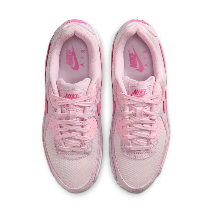 Women's pink lace-up sneakers viewed from above, showing padded tongues and insoles