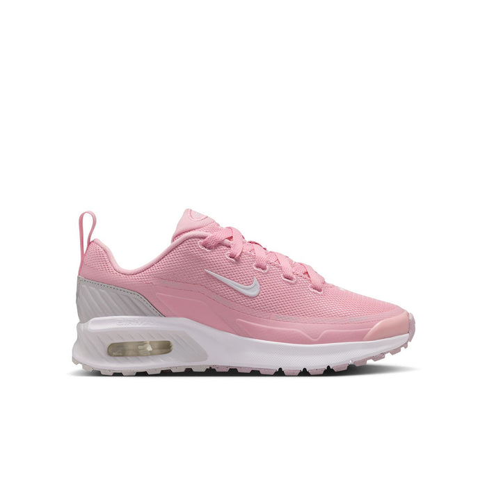 Youth running sneaker in medium soft pink with white Swoosh and visible air unit sole