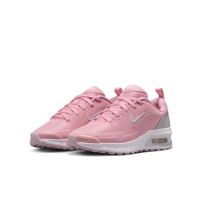 Pink youth running sneakers, side view with white Swoosh and cushioned air sole