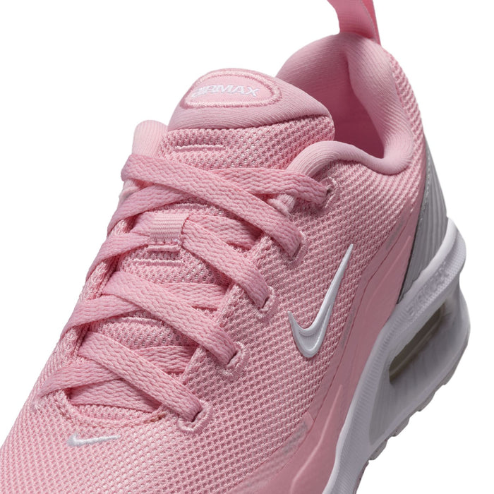 Close-up of pink lace-up youth sneaker with white Swoosh and mesh upper