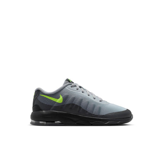 Kids' grey low-top sneakers with black accents and neon green Swoosh