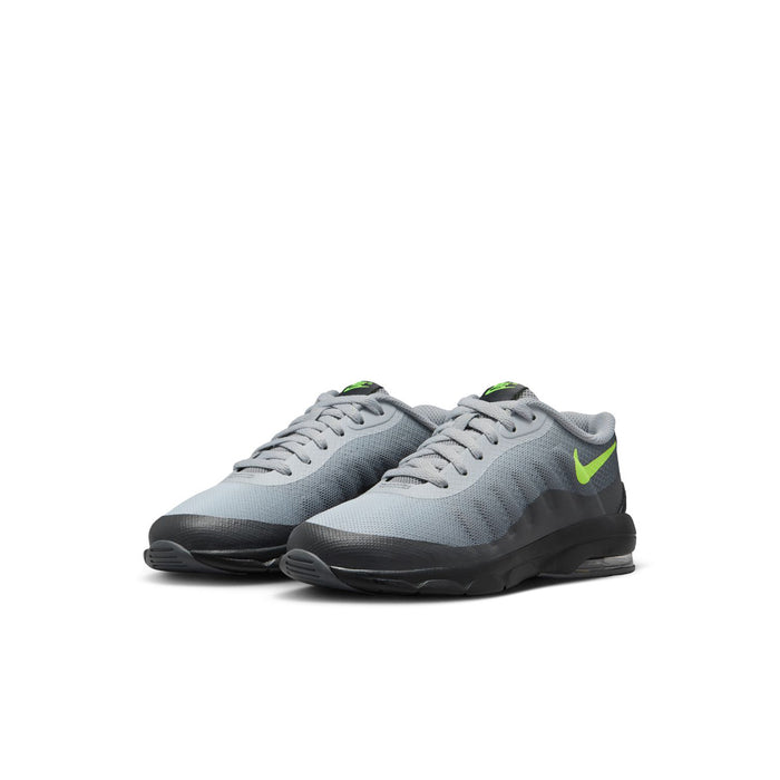 Pair of kids' grey knit sneakers with black sole and neon green side Swoosh