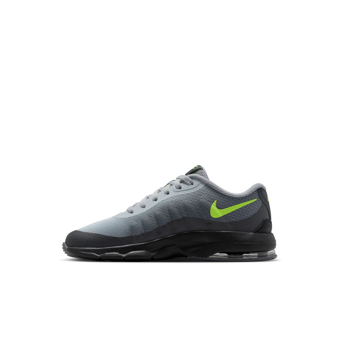 Kids' grey low-top sneaker with neon green Swoosh and black outsole with air unit