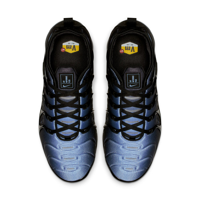 Pair of sneakers with black tongues, blue accents, and lace-up collar
