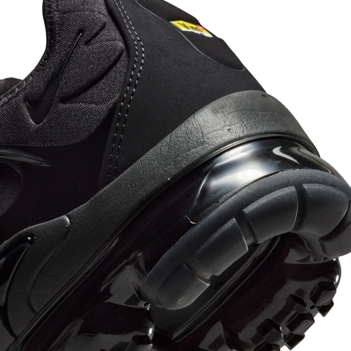 Men's black sneaker close-up of Air pod outsole and side overlay