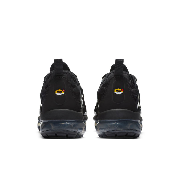 Women's black sneakers from heel view with cushioned back tab and air-sole cushioning.