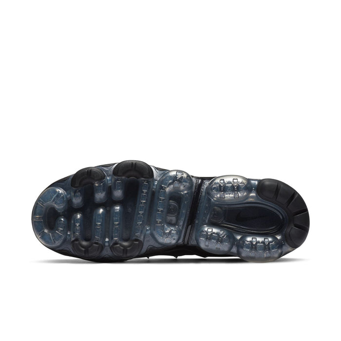 Women's black outsole with visible Air units and tread pattern for traction.