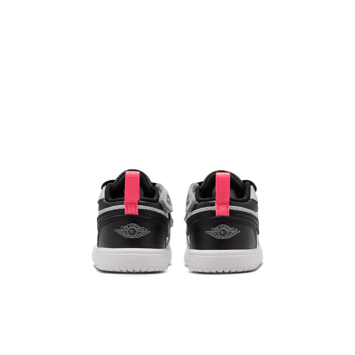 Kids low-top sneakers with black heel and red pull tab, white midsole trim