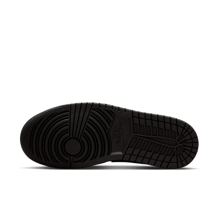 Black low-top sneaker outsole with tread and Jumpman logo details.