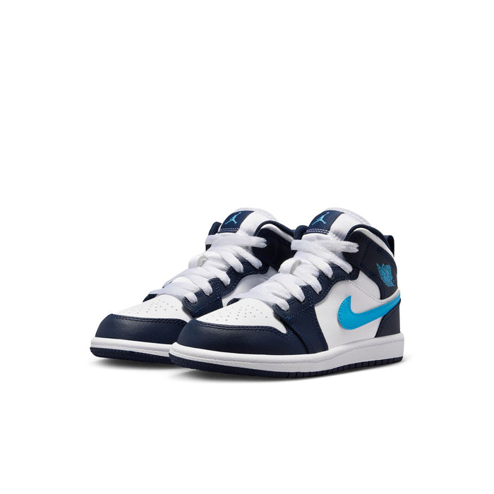 Kids mid-top sneakers, navy and white with light blue swoosh, front view with laces