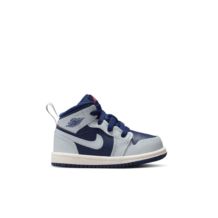 Toddler mid-top sneakers in navy and white with lace-up closure and swoosh logo