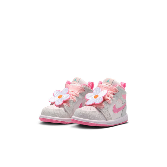 Toddler mid-top sneaker pair in light gray with pink floral applique and Swoosh