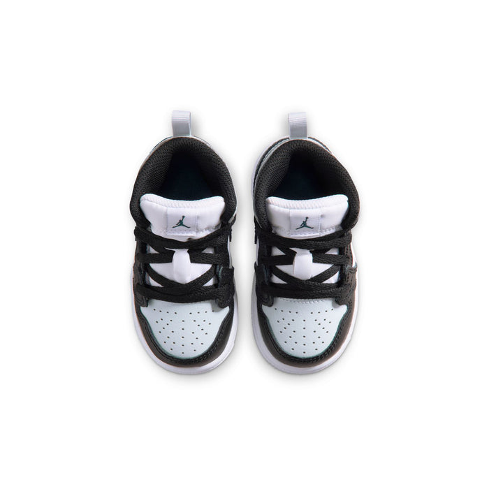 Toddler sneakers showing cushioned collars and black laces with white lining