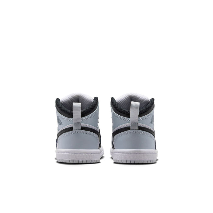 Toddler sneakers with rear heel tabs in light gray, black collar, and white midsoles