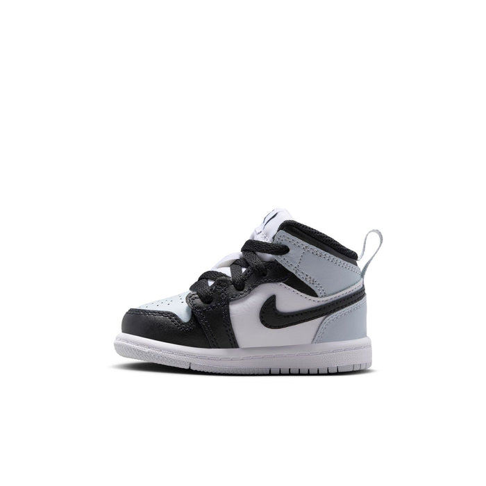 Toddler mid-top sneakers side view in black and white with gray toe and lace-up front