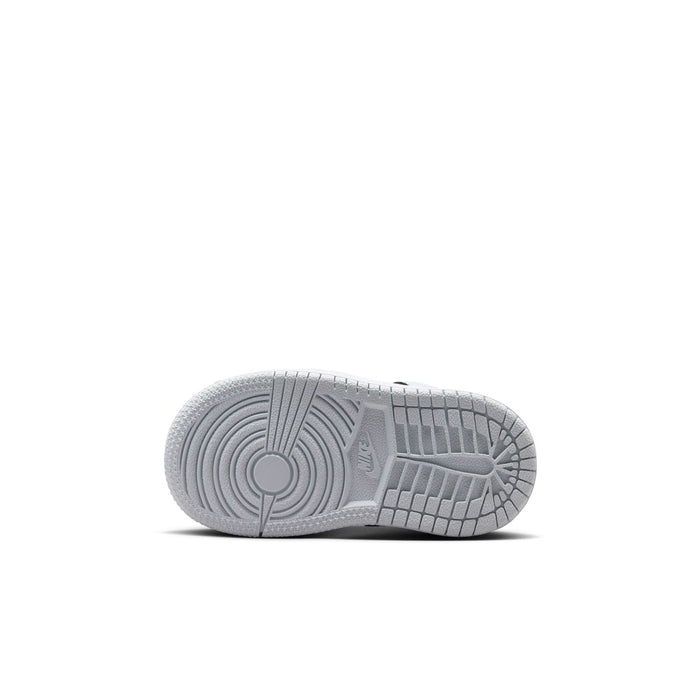 Toddler sneaker outsole in light gray with traction grooves and circular pattern