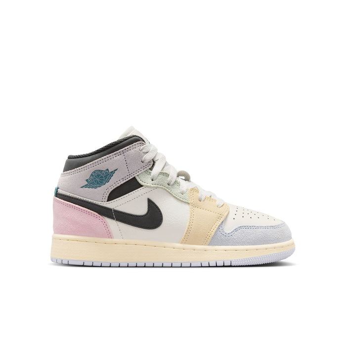 Air Jordan 1 Mid youth sneakers side view, black swoosh, pink heel, teal wing logo