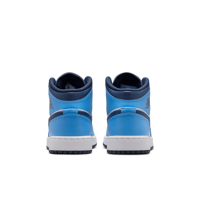 Youth mid-top sneakers heel view in light blue with white side panels and navy collar