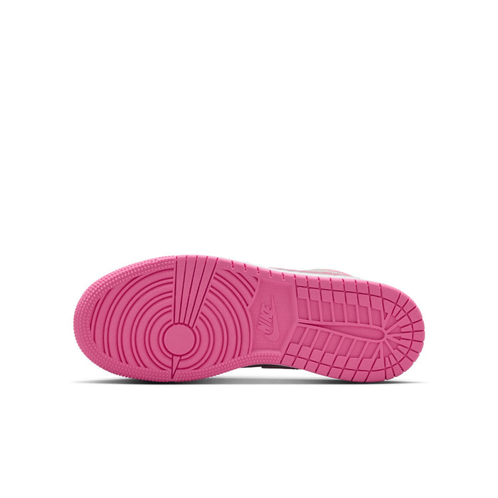 Youth mid-top sneakers outsole view in bright pink with textured traction tread.