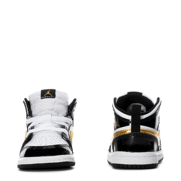 Toddler high-top sneakers, black-and-white rear view with gold trim on collar